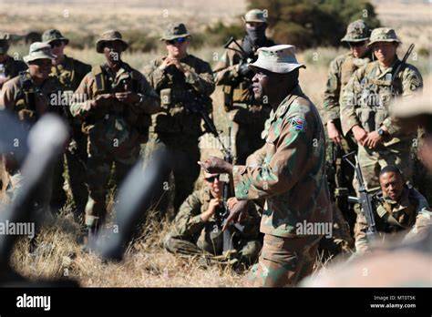 A group of South African Army Infantry Corps soldiers engage in a training exercise.