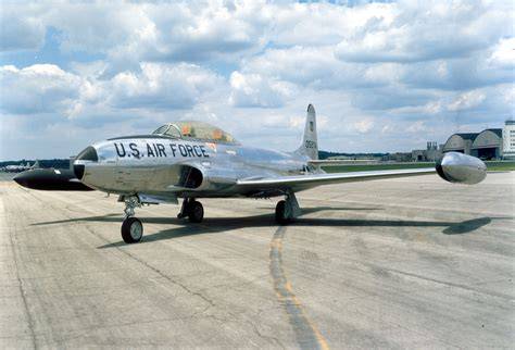 The entrance of a museum featuring the Lockheed T-33 Shooting Star.