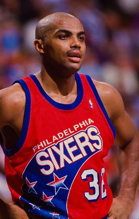 Charles Barkley dribbling the ball while playing for the Philadelphia 76ers.