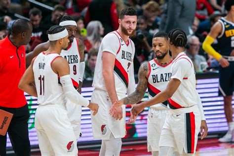 A collage of highlights from a double-overtime game featuring the Portland Trail Blazers against the Los Angeles Lakers.