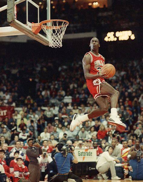 Michael Jordan dribbling the basketball during a game as a member of the Chicago Bulls.