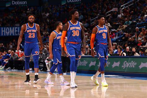 New York Knicks players engaged in a defensive drill during practice.