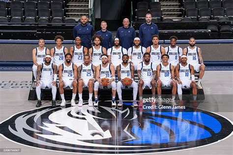 A Dallas Mavericks player receiving medical attention from the team doctor.