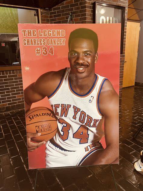 Charles Oakley securing a rebound in a game for the New York Knicks.