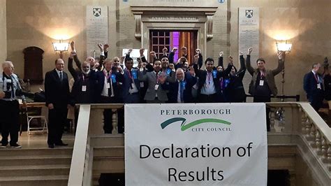 Local officials announcing the results of the Peterborough City Council election to a crowd of residents.