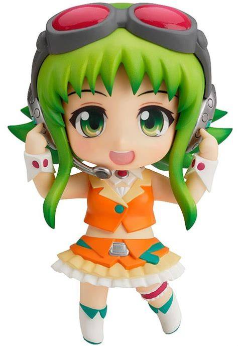 A figurine of Gumi, the Vocaloid character, with a colorful backdrop.