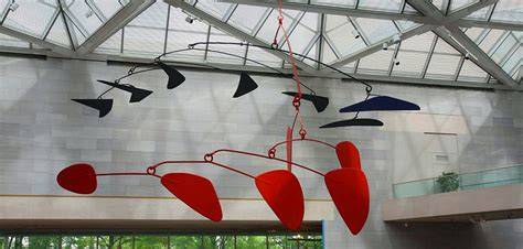 an Alexander Calder mobile sculpture gracefully moving