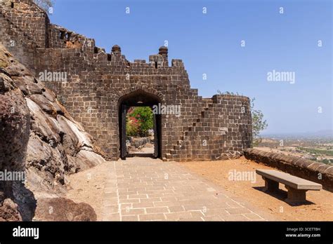 Visitors walking through the ancient walls of Sangagiri Fort.