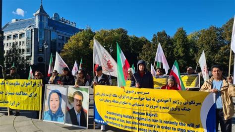 Writers holding banners at a rally advocating for freedom of expression.