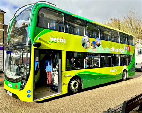 A Southern Vectis bus parked at a major town stop, with passengers getting on.