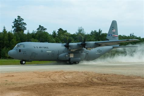 A C-130 Hercules aircraft in action during a military operation.