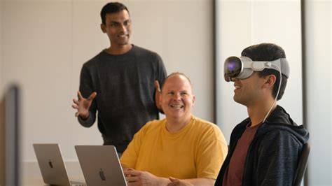 A developer focused on creating an Apple accessory prototype at a workspace.