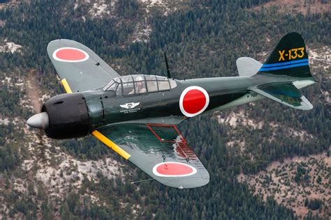 An A6M Zero fighter aircraft in action during a naval operation.
