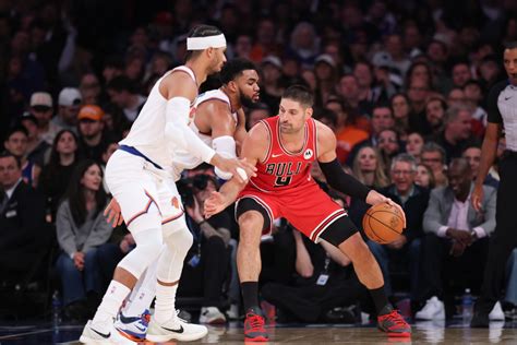Chicago Bulls players defending against the New York Knicks in a tense playoff moment.
