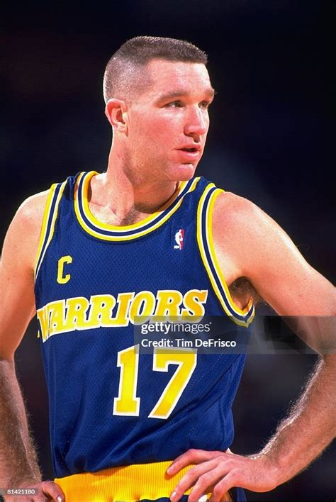 Chris Mullin dribbling the ball during a game.