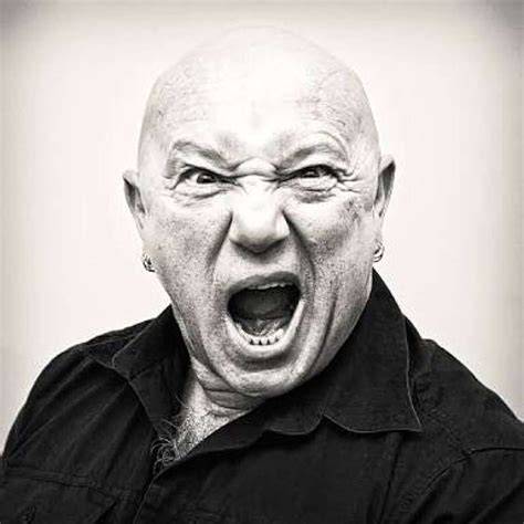 Angry Anderson being interviewed on a TV set.