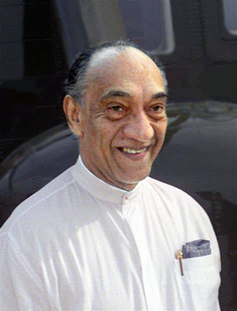 A politician signing important documents related to economic reforms.