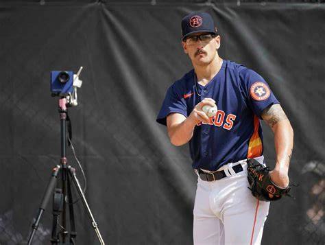 A new starting pitcher for the Houston Astros practicing pitching.
