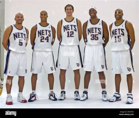 The New Jersey Nets players celebrating after a victory on the court