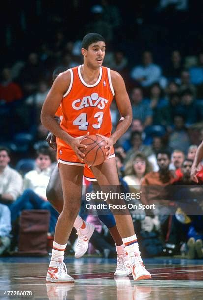 Brad Daugherty in action, shooting a basketball during a game.