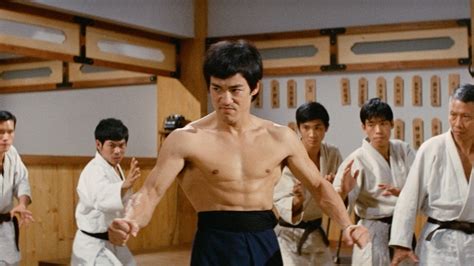 Bruce Lee performing a martial arts move in a movie