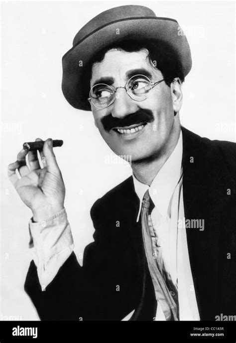 A classic portrait of Groucho Marx smiling