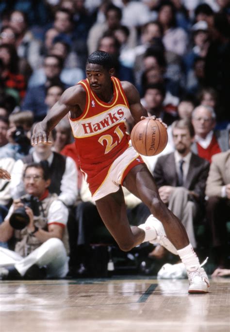 Dominique Wilkins making a basket during a critical game.