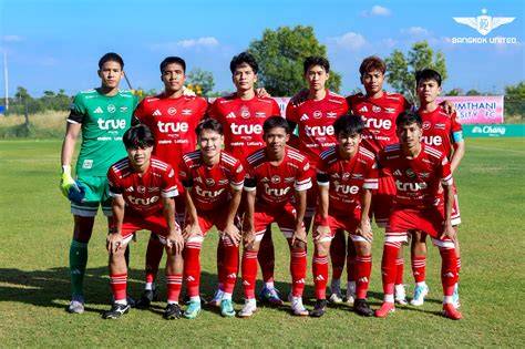 Bangkok United U21 players warming up before a game.