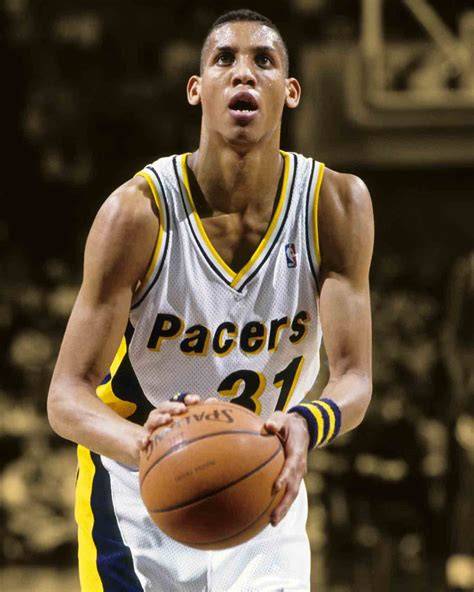 Reggie Miller dribbling the basketball during a game for the Pacers.