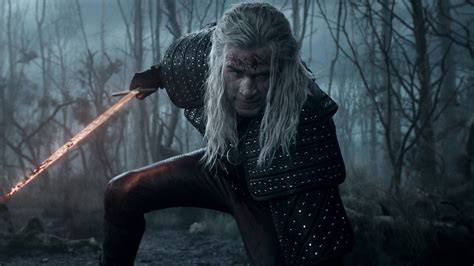 Geralt of Rivia wielding a sword during a fierce battle.
