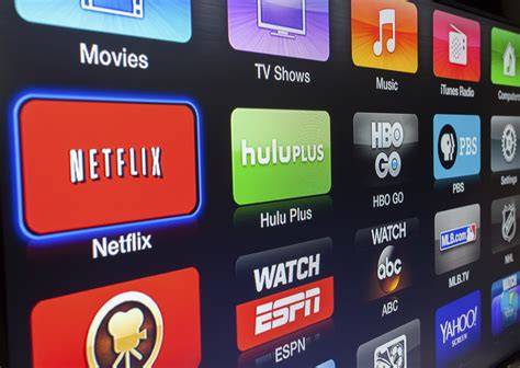 A close-up of a smart TV interface displaying various streaming media services.