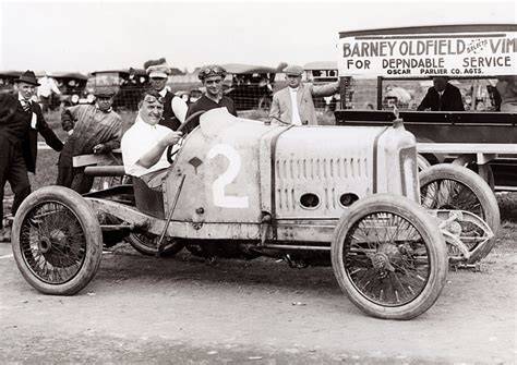 Barney Oldfield setting a speed record in a historic race.